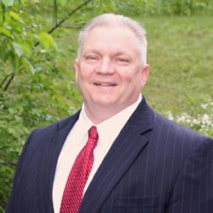 Board member Michael Ventura smiles in headshot photo