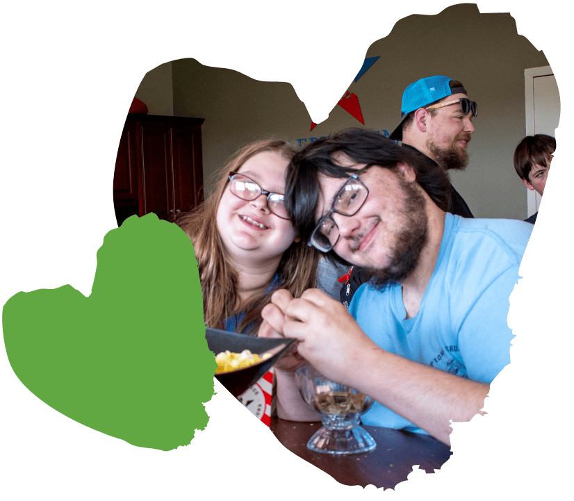Two smiling children holding a bowl, emanating the warmth often seen in successful clinical services.